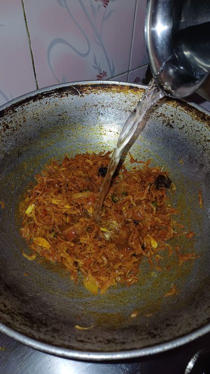 Step 1.1: Pour in hot water, cover the pan, and cook on low flame for 5-7 minutes
