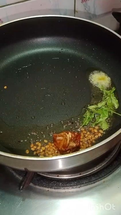 Step 2.1: Add mustard seeds, urad dal, curry leaves, dry red chillies, finely chopped ginger, green chilli, and asafoetida to the hot oil or ghee