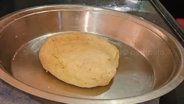 Step 2.1: Grease the dough with butter or oil, cover with a damp wet cloth, and let it rest for 10-15 minutes to activate the gluten