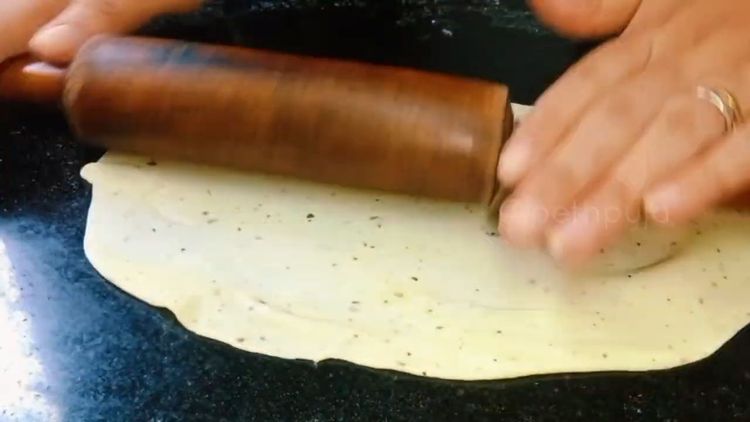 Step 4.1: Roll a small ball of dough into a thin chapati