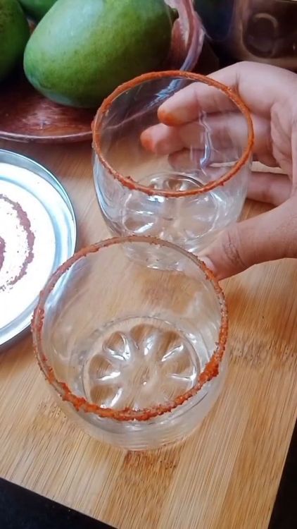 Step 1.1: Coat the rim of the serving glass with lemon juice and dip it into the red chili salt mixture