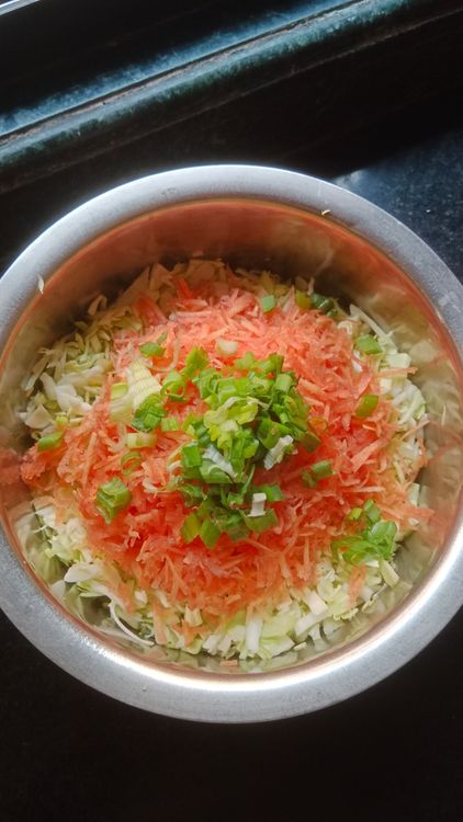 Step 1.1: Finely grate cabbage, carrots, capsicum, onions and chopped fresh coriander leaves