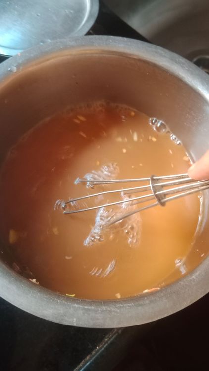 Step 2.3: Mix Ching's Manchurian masala mix with the reserved squeezed water and additional water