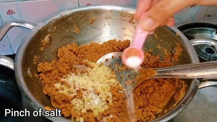 Step 1.2: Switch off the flame and let it cool down a bit then mix in grated jaggery, cardamom powder, crushed edible gum, and a pinch of salt