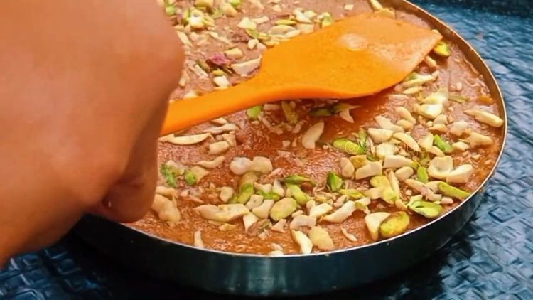 Step 1.2: Spread some chopped dry fruits and press gently