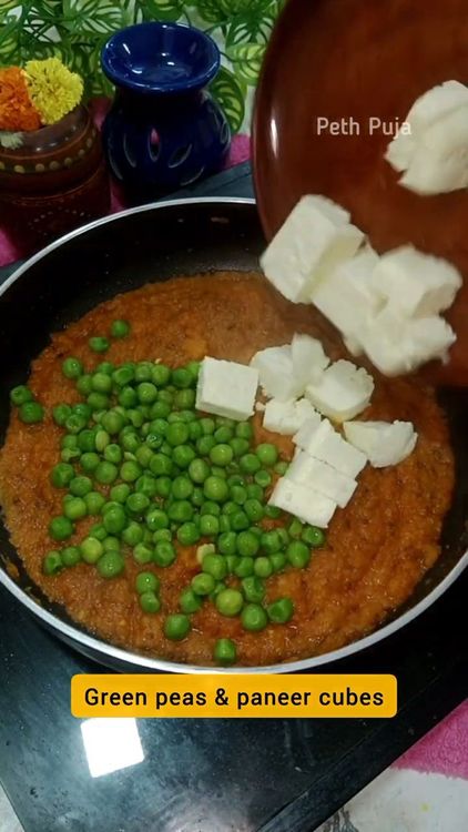Step 2.1: Add paneer cubes, green peas, and biryani masala or garam masala