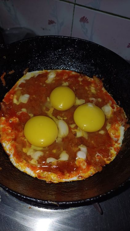 Step 1.1: Crack the eggs into the pan and mix gently