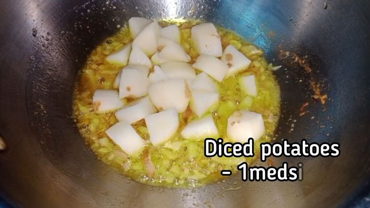 Step 2.1: Add diced potato and 1 tsp turmeric powder