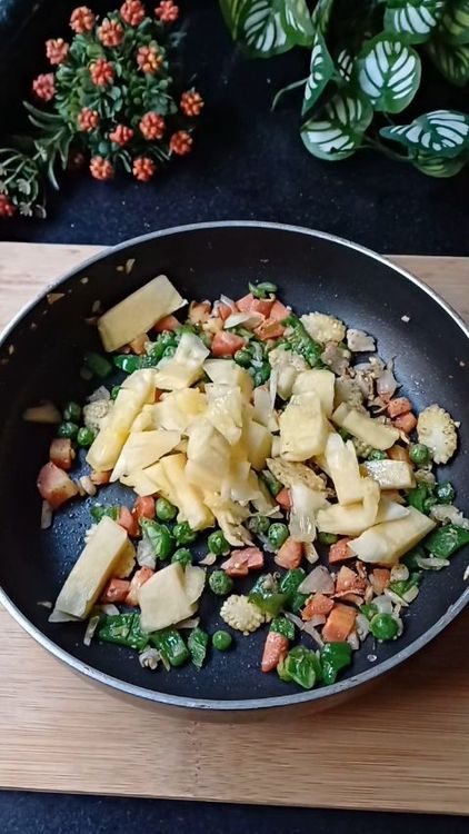 Step 1.1: Add diced pineapple and toss for another minute
