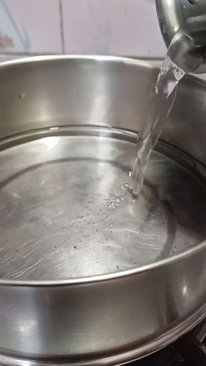 Step 1.1: Heat water in a pan and add a pinch of salt