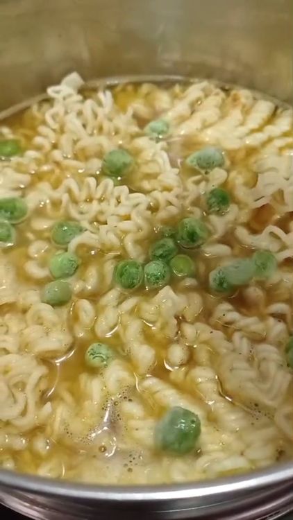 Step 1.2: Empty the Maggi packet into the pan, including the noodles and masala mix