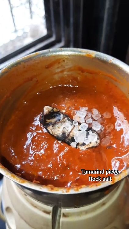 Step 2.1: Grind the roasted spices into a fine paste by adding tamarind and rock salt