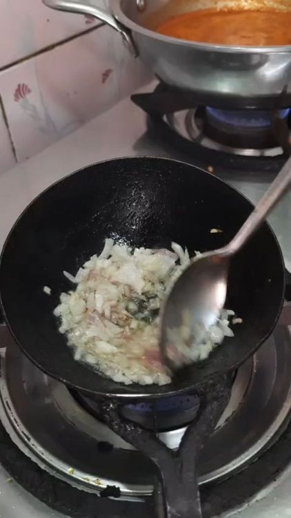 Step 3.1: Meanwhile, heat oil in another pan and fry finely chopped onion until it turns translucent and caramelized