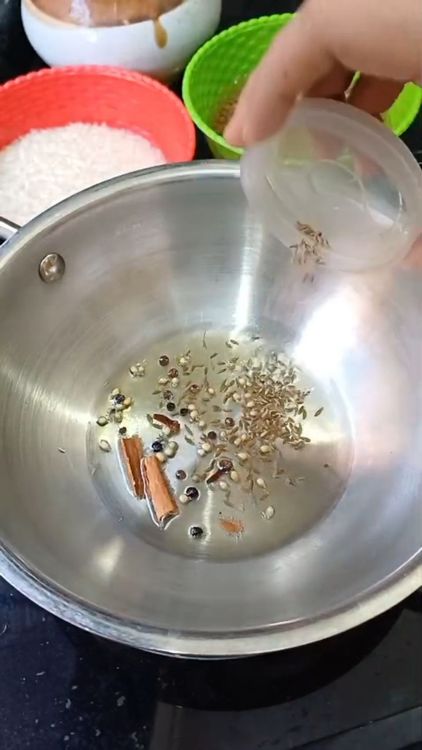 Step 1.1: Heat oil in a pan and crackle cumin seeds, crushed coriander seeds, cinnamon stick, cloves, and black pepper corns