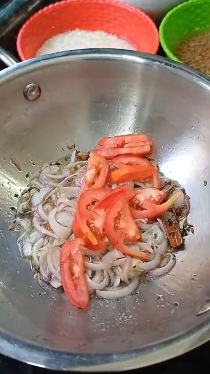 Step 1.1: Add sliced tomato and cook until it softens
