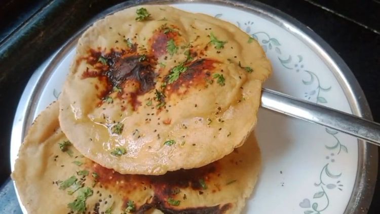 Step 1.2: Brush the cooked roti with butter or ghee and garnish with coriander leaves before serving