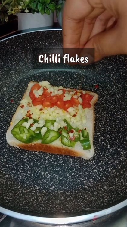 Step 1.1: Sprinkle chilli flakes, oregano, and a pinch of salt if needed