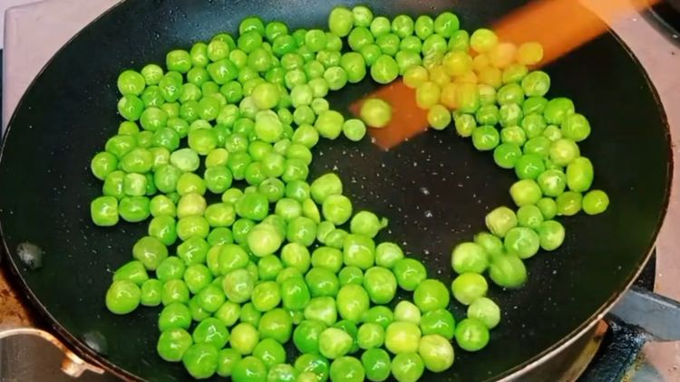 Step 3.1: In the same pan, sauté green peas with a dash of salt in ghee