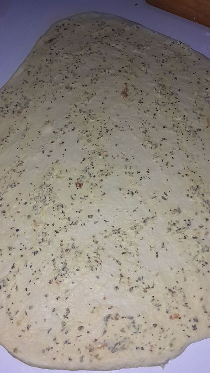 Step 5.1: Punch down the dough, spread and roll out, and slightly flatten