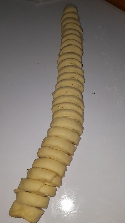 Step 5.2: Cut the rolled coated dough into 1-inch pieces and arrange in a greased loaf pan