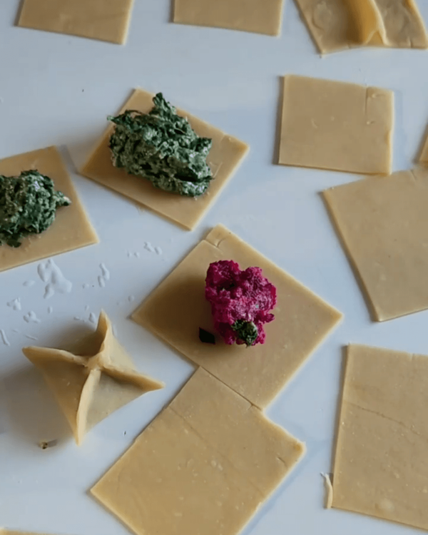 Step 3.1: Cut pasta sheets into squares and place a small amount of filling in the center