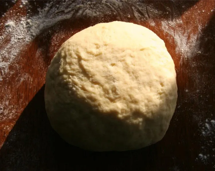 Step 1.1: Add 1/3 cup of the reserved cooking liquid and add the flour, a little at a time, to form a dough