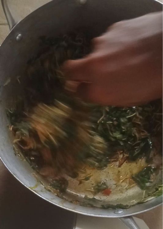 Step 10.1: Mix thoroughly until the Abacha, Ugba, palm oil, pepper, and garden egg leaves blend into one beautiful, colorful sauce