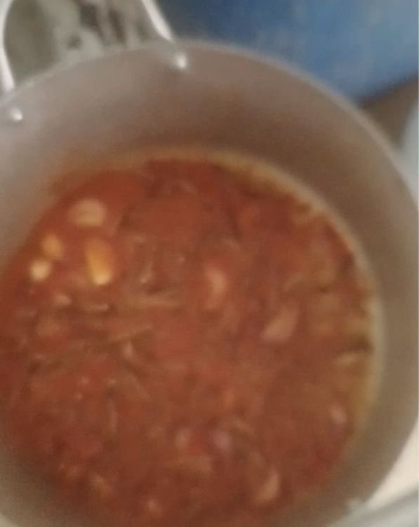 Step 5.1: Place the pot on the fire, cover, and let it cook gently for about 5 minutes to release the flavors