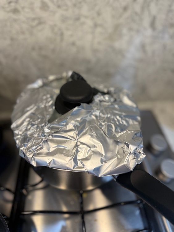 Step 3.1: After 15 minutes, cover the rice with a lid and foil, turn off the heat, and let it steam for 8 minutes