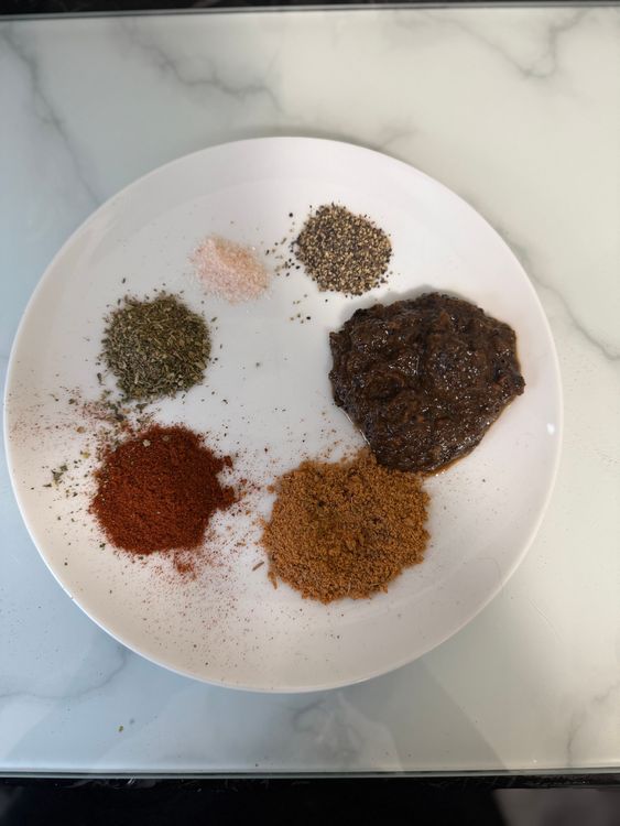 Step 2.1: Marinate the chicken wings with jerk marinade, dry jerk seasoning, salt, and pepper
