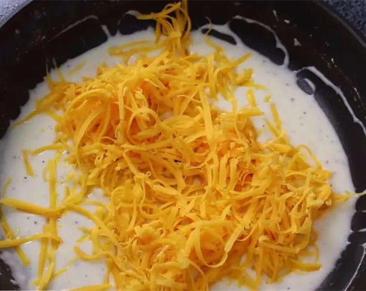 Step 1.1: Stir in the aged cheddar cheese
