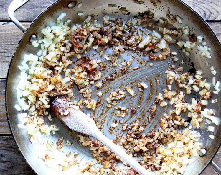 Step 1.1: In a large pan set over medium heat, sauté the onions and garlic in olive oil until the onions are translucent