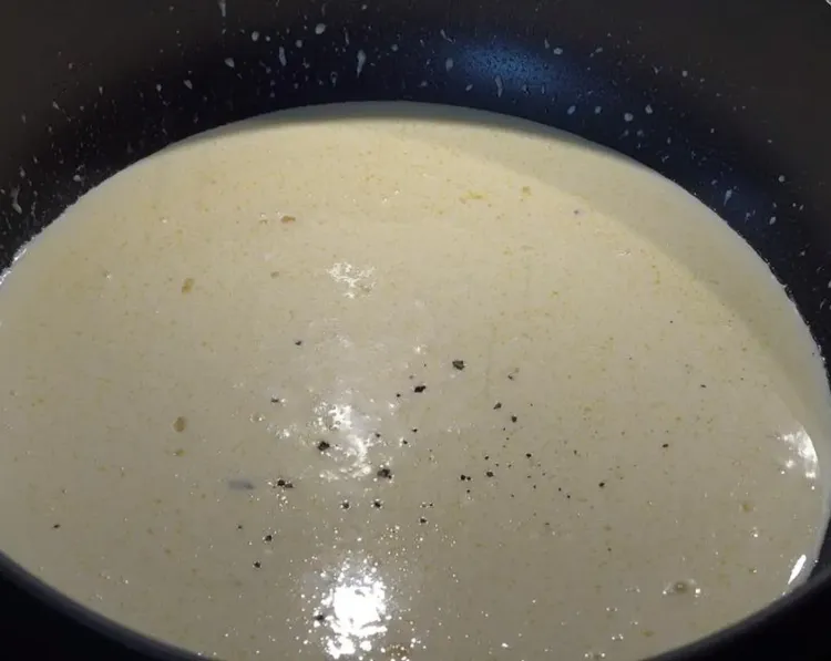Step 1.1: Pour whipping cream into the garlic mix and stir