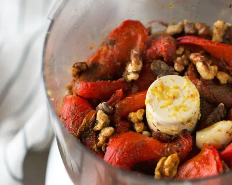 Step 3.1: Peel the skins off the peppers and transfer them into the bowl of a food processor