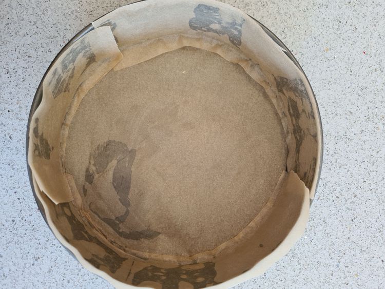 Step 1.1: Grease a cake tin with oil or butter, line the base and sides with baking paper and set it aside