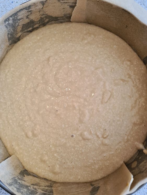 Step 1.1: Pour the batter into the cake tin and spread it evenly