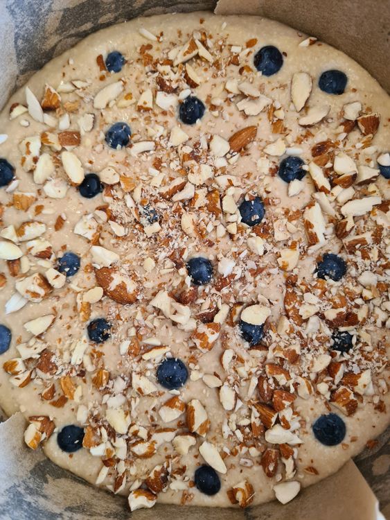 Step 1.1: Sprinkle chopped almonds and place some blueberries on top