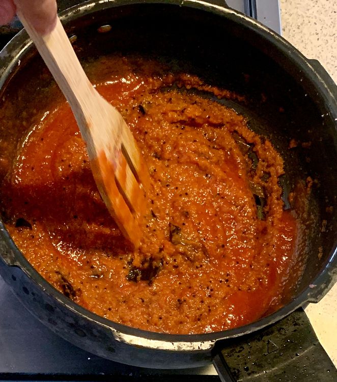 Step 1.3: Stir in the kashmiri red chilli powder and tomatoes to the mixture