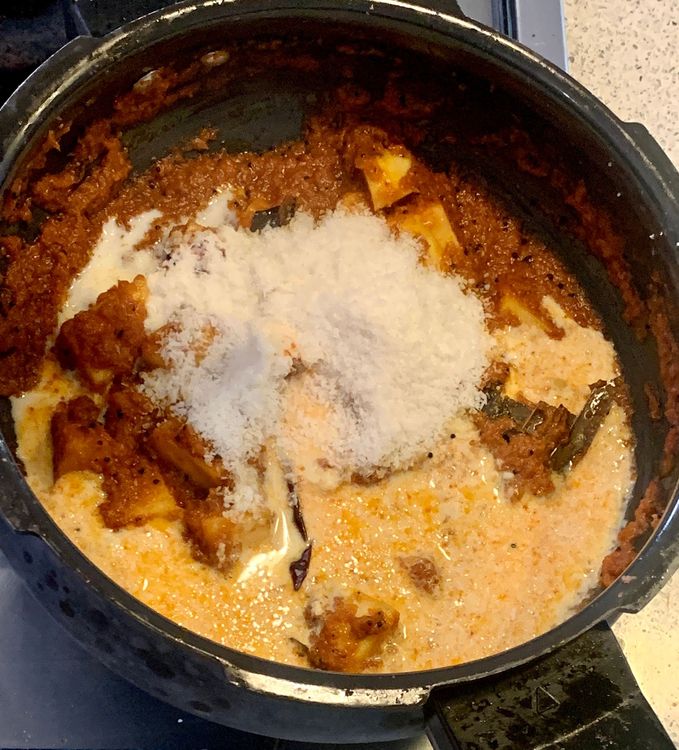 Step 1.2: Add the desiccated coconut and milk and mix with the spices and potatoes