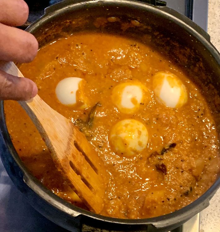 Step 1.1: Gently add the hard-boiled eggs and fenugreek leaves to the curry, cover the pot again and let the curry simmer for another 5 minutes to allow the flavours to meld together
