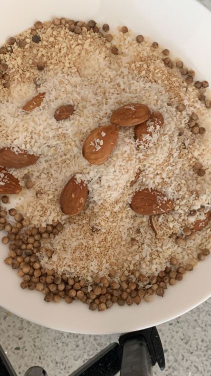 Step 2.1: Using a mixer grinder, finely grind poppy seeds, almonds, sesame seeds, desiccated coconut, and coriander seeds until it forms a smooth powder