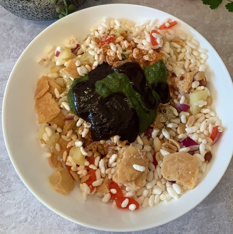 Step 1.1: Drizzle the tamarind chutney and green chutney over the ingredients