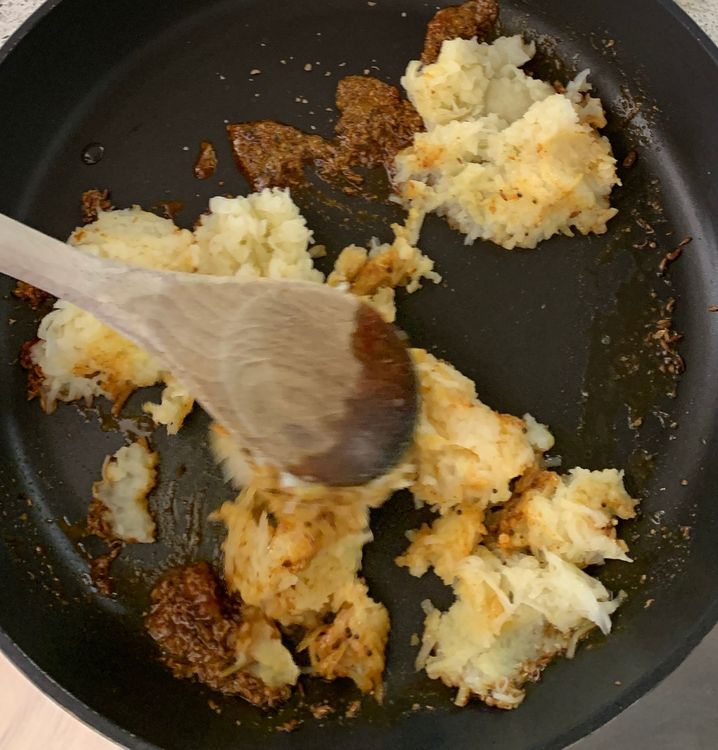 Step 1.1: Add the mashed potatoes and chopped coriander leaves to the pan
