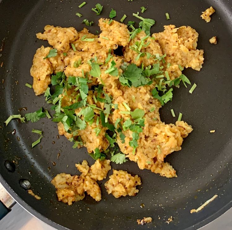 Step 1.2: Add the mashed potatoes and chopped coriander leaves to the pan