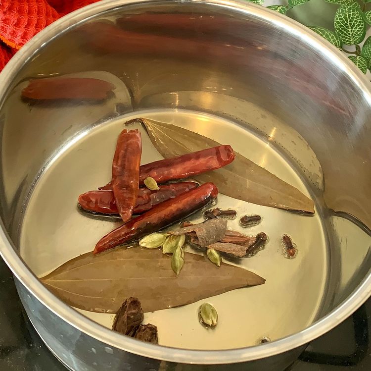 Step 1.1: Heat a tbsp of mustard oil in a heavy-bottomed pot