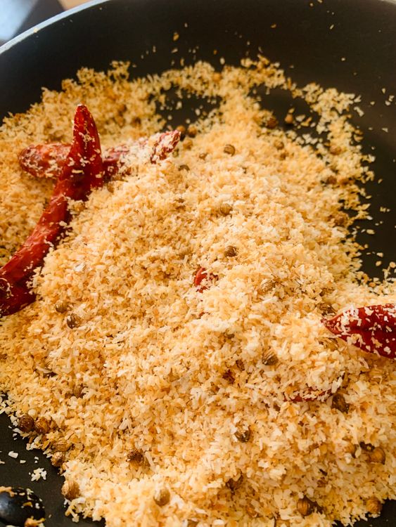 Step 1.2: Dry roast the desiccated coconut, dry red chillies, and coriander seeds until they turn slightly brown