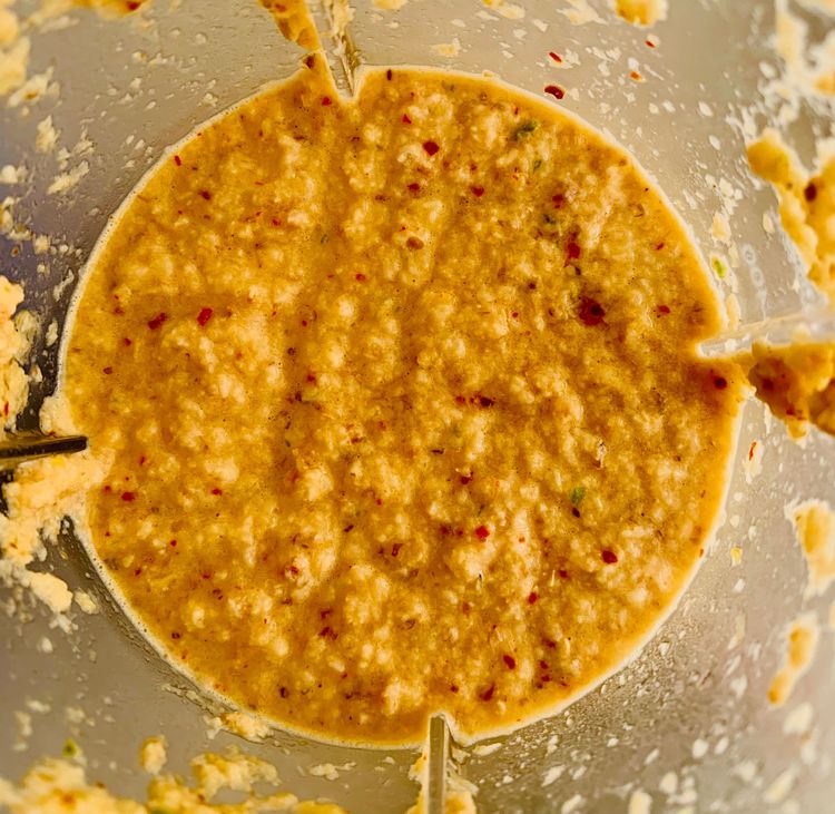Step 1.2: Grind the roasted coconut mixture with garlic cloves and green chillies to form a paste
