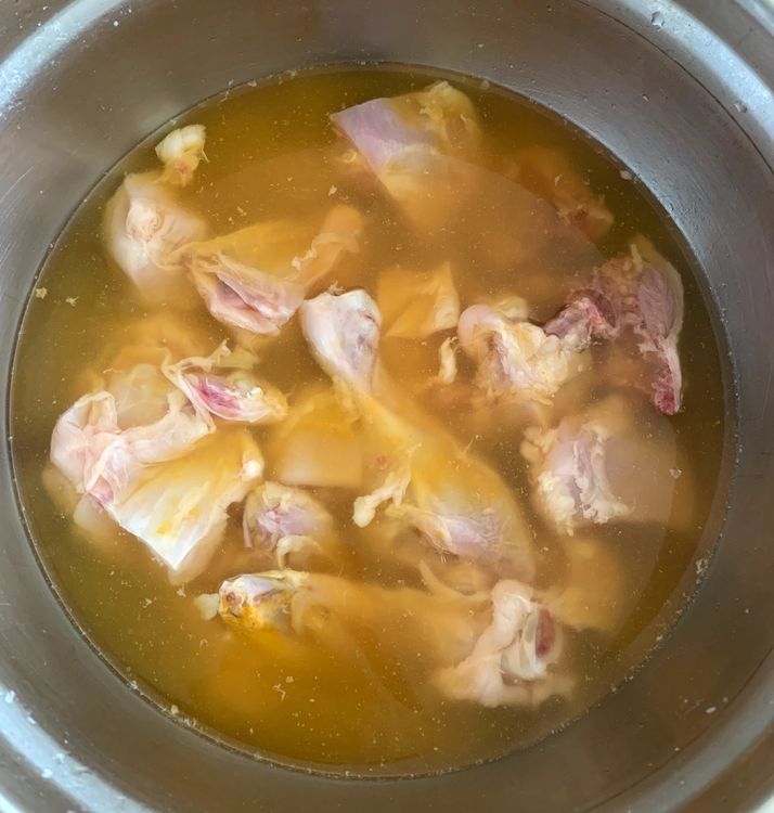 Step 1.1: Soak chicken pieces in water with a teaspoon of turmeric for 15 minutes