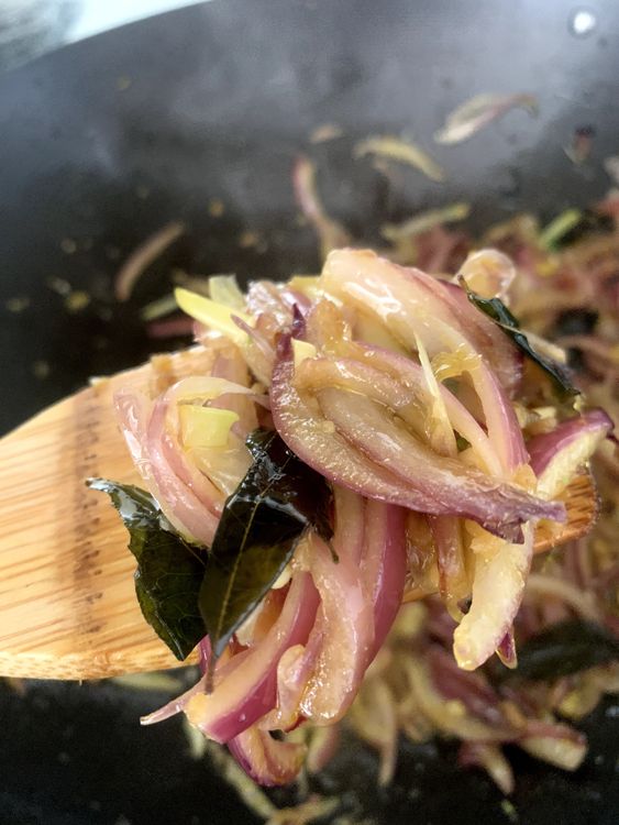 Step 1.1: Add curry leaves, sliced onions, ginger and garlic