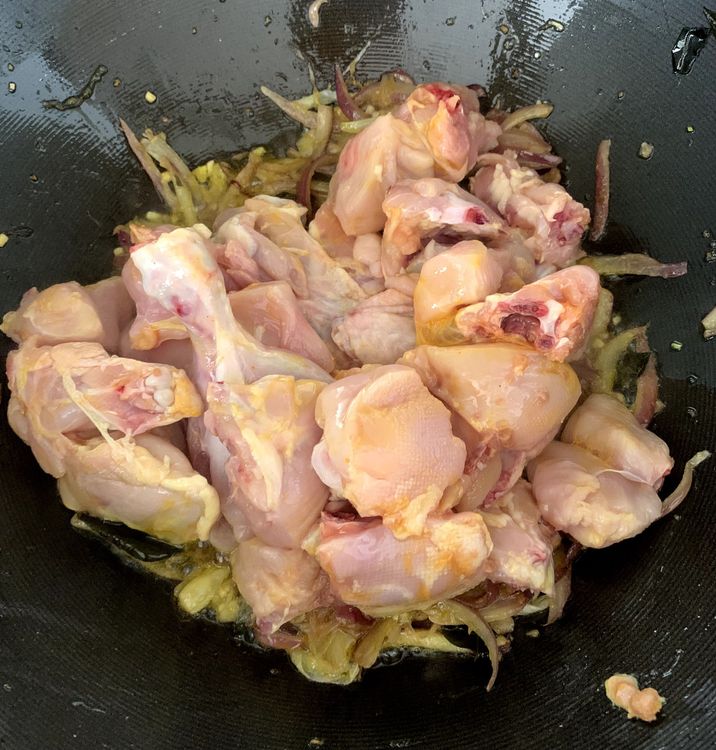 Step 1.1: Add the chicken to the wok and stir until it changes colour